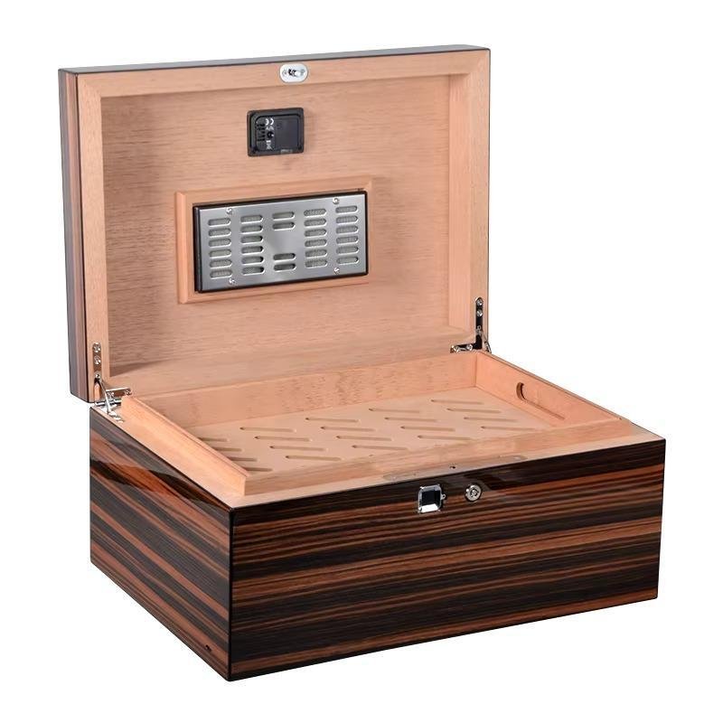 Wooden cigar box with a built-in humidification system and hygrometer.