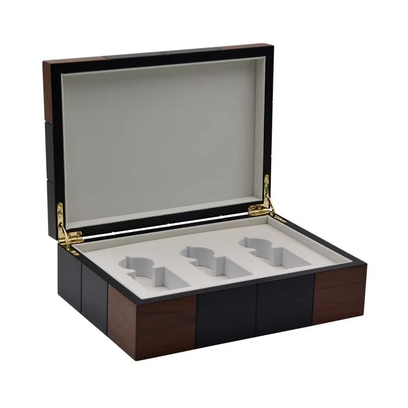 Wooden gift box with foam compartments designed to hold two items, ideal for gifting.