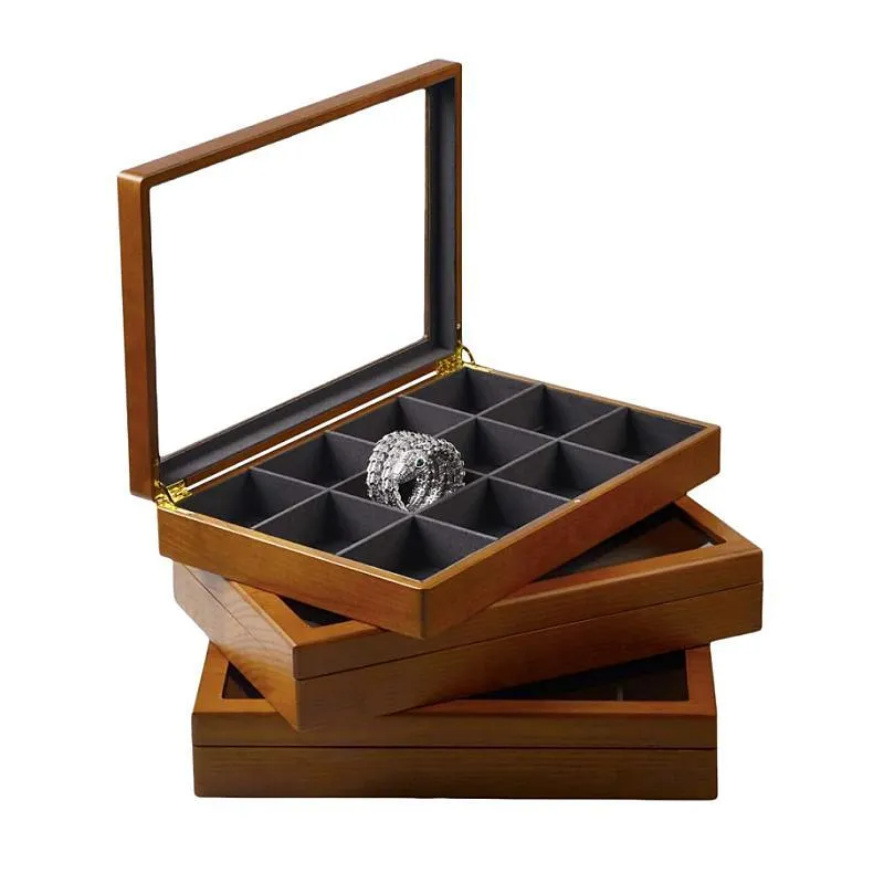 Wooden jewelry box with a glass lid, 12 individual compartments, and stackable design for organizing jewelry.