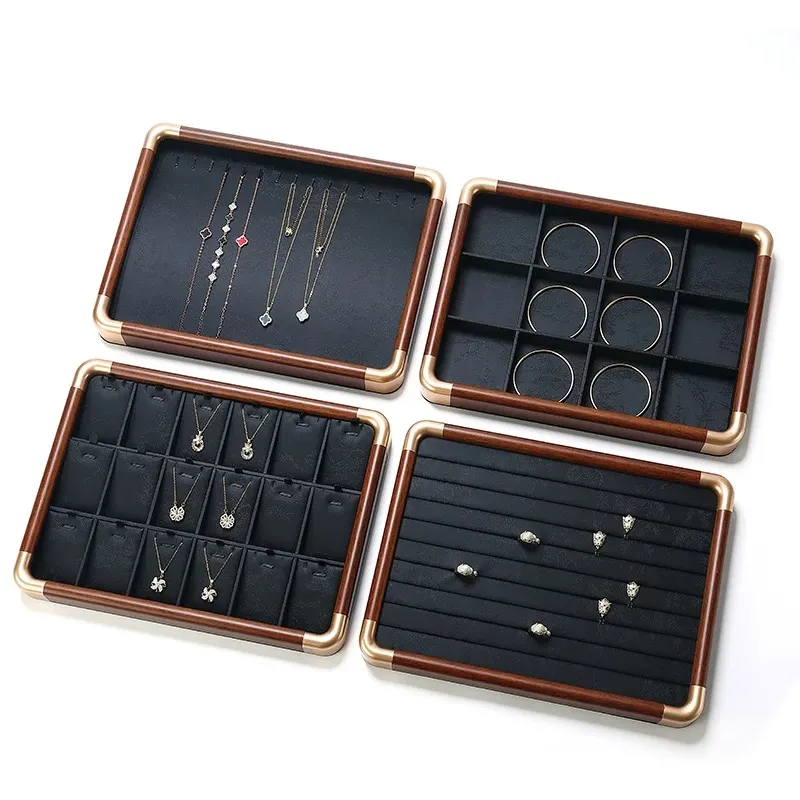 Set of wooden jewelry trays with velvet-lined compartments for necklaces, rings, earrings, and bracelets.