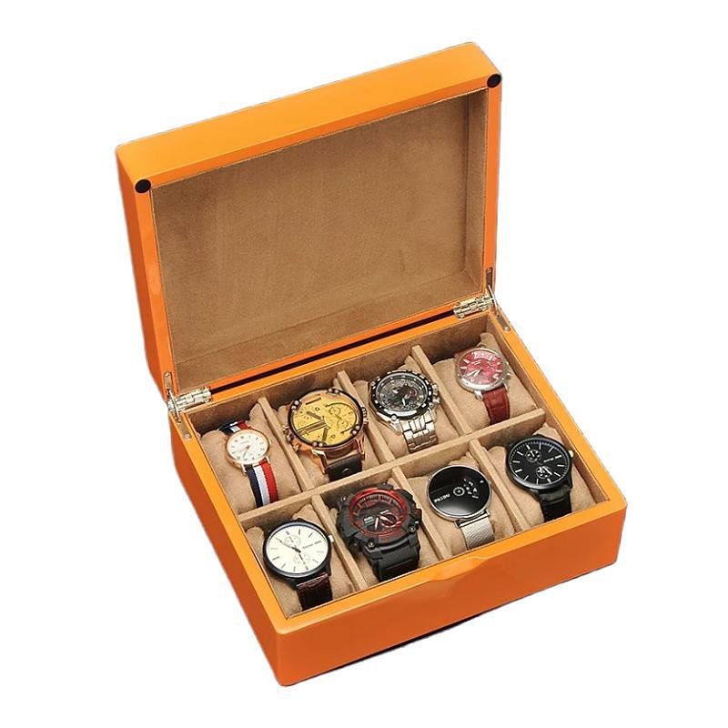 Bright orange wooden watch box with soft suede interior and 8 cushioned compartments for organized watch storage.