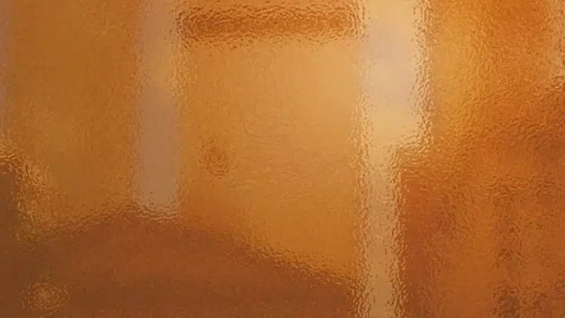 Close-up of orange peel texture on a high-gloss painted surface