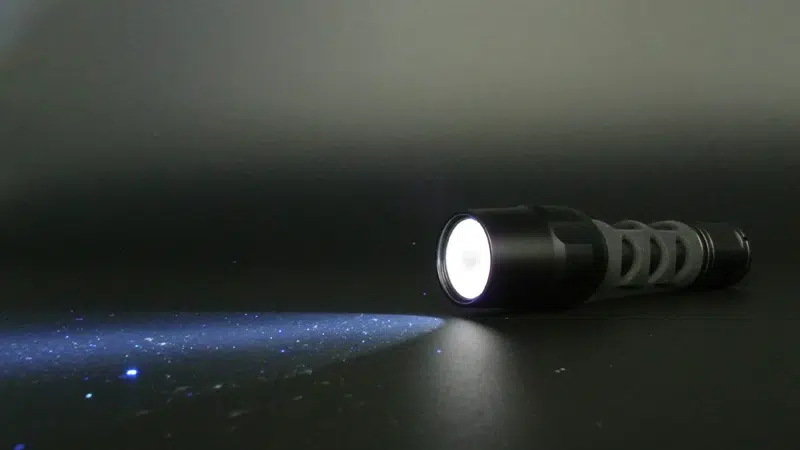 Dust particle on cured lacquer under LED