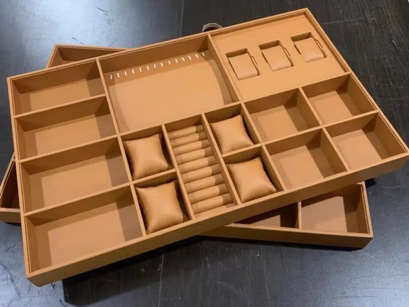 PU leather being applied to luxury jewelry box insert