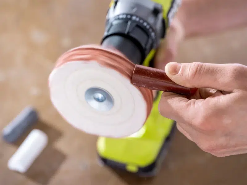 Polishing tools and compounds laid out on a workbench