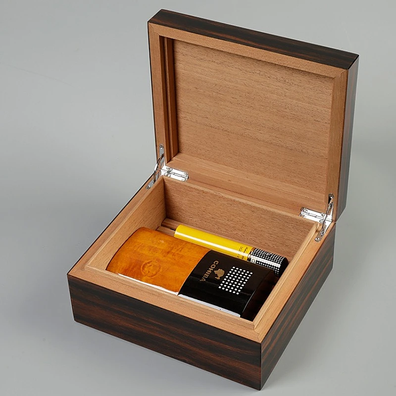 Wooden cigar humidor with Cohiba accessories