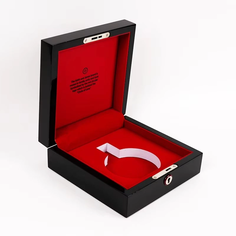 Glossy black perfume box with red velvet interior