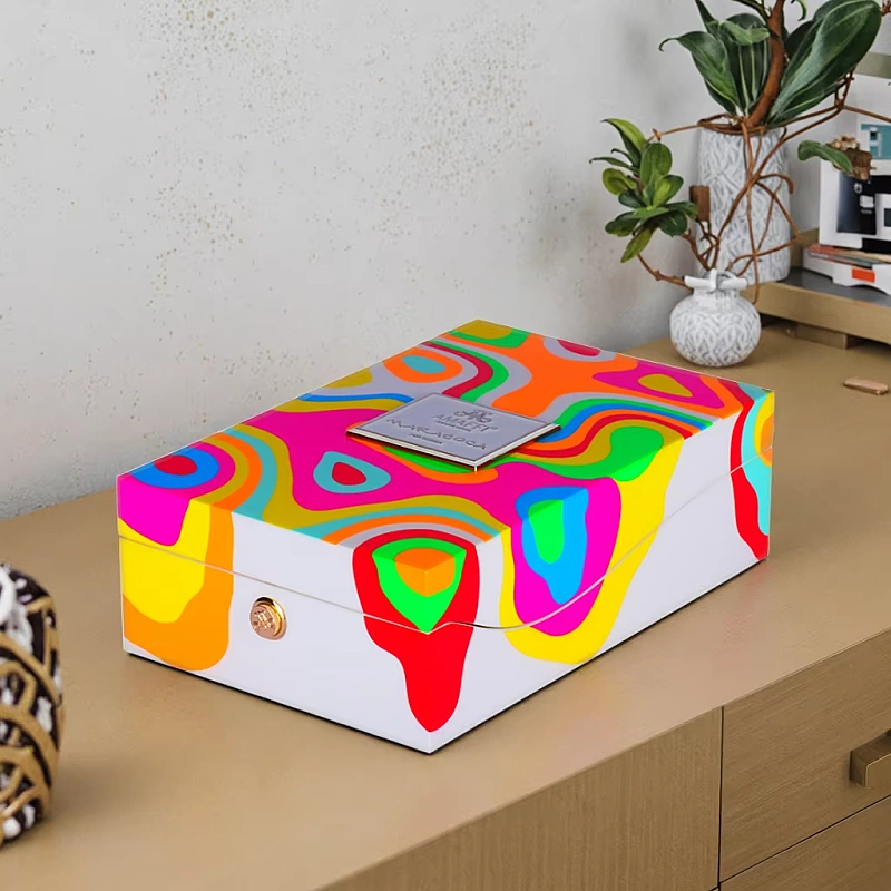 Colorful AMAFFI perfume box on wooden cabinet