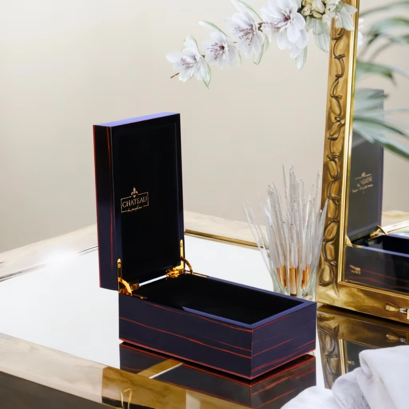Open CHATEAU perfume box on mirrored vanity