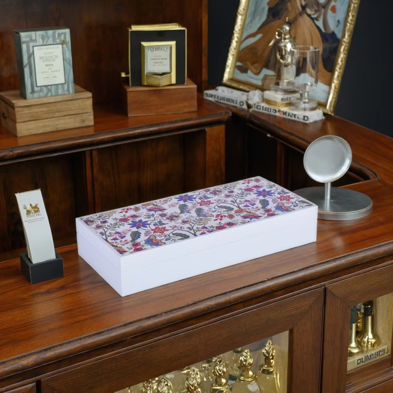 Floral printed perfume box on wooden counter