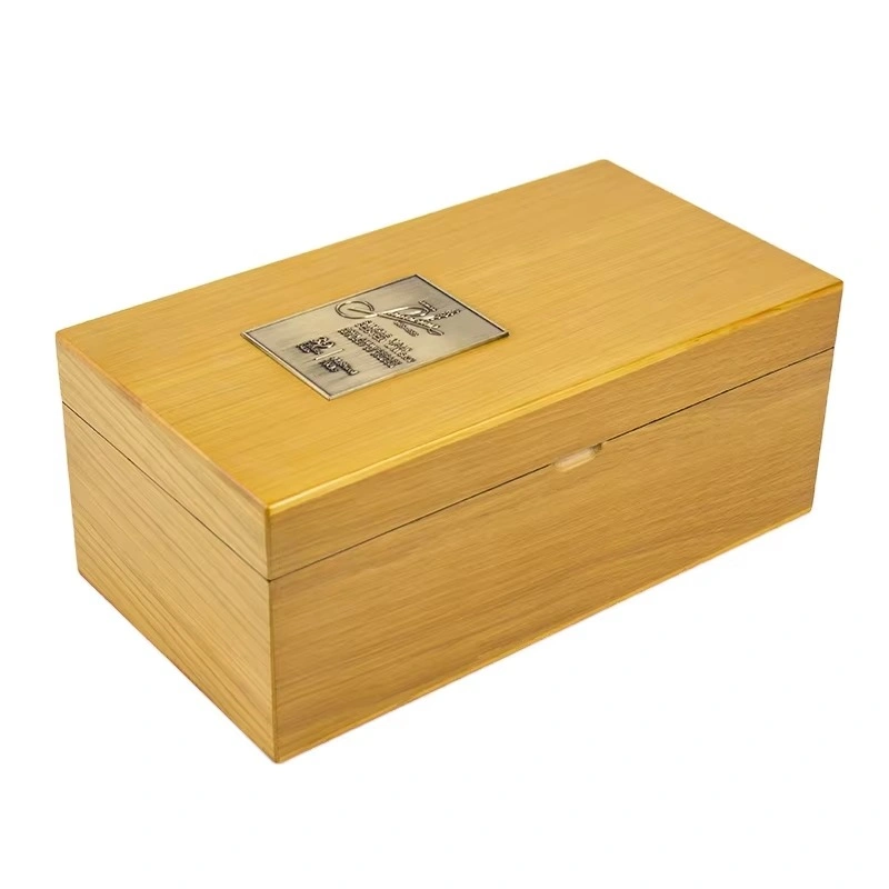 Light wood whisky box with metal label on top