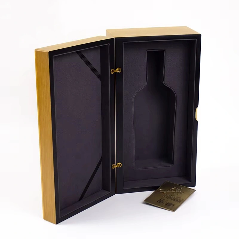 Open light wood whisky box with black foam insert