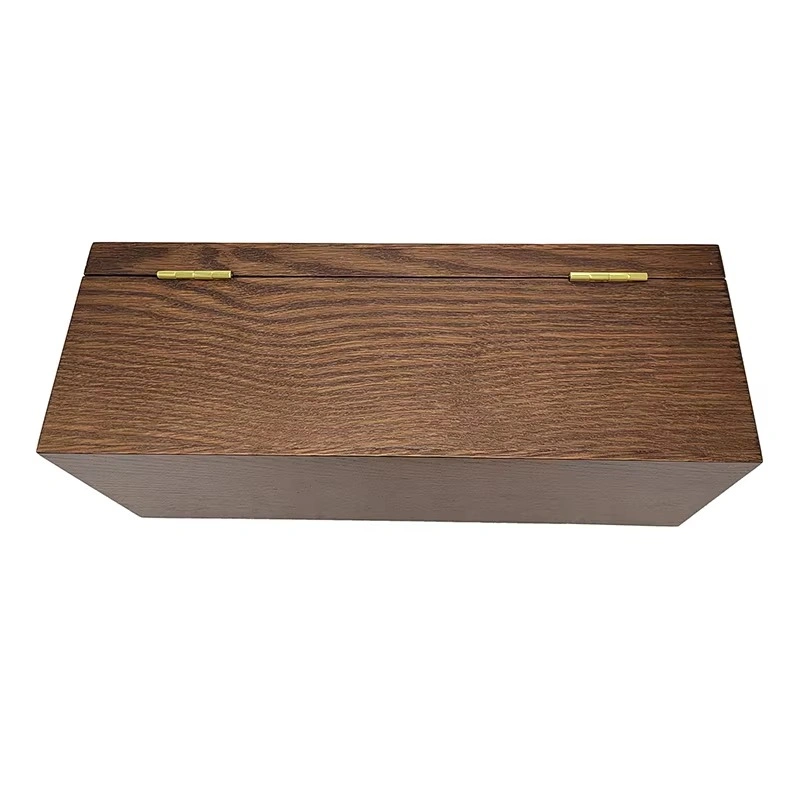 Closed wooden whisky box with visible grain and gold hinges